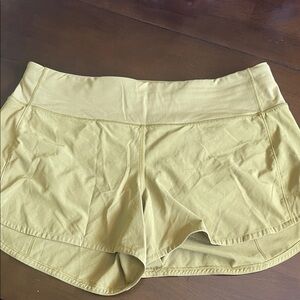 Lululemon Speed Up yellow shorts, 4”, size 10.